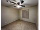 Spacious bedroom with tile flooring and a ceiling fan at 3719 W Woodridge Dr, Glendale, AZ 85308