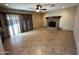 Bright living room with tile flooring and a fireplace at 3719 W Woodridge Dr, Glendale, AZ 85308