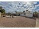 Spacious backyard with gravel landscaping, a shed, and a view of the pool at 4102 E Blanche Dr, Phoenix, AZ 85032