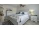 Main bedroom with king-size bed, dresser, and ceiling fan at 4102 E Blanche Dr, Phoenix, AZ 85032