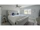 Spacious main bedroom with plush upholstered bed and ceiling fan at 4102 E Blanche Dr, Phoenix, AZ 85032