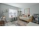 Bright bedroom with a daybed, cat tree, and lots of natural light at 4102 E Blanche Dr, Phoenix, AZ 85032