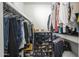 Large walk-in closet with ample hanging and shoe storage at 4102 E Blanche Dr, Phoenix, AZ 85032