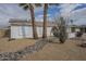 Single-story home with two palm trees and gravel landscaping at 4102 E Blanche Dr, Phoenix, AZ 85032