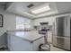 Modern kitchen boasting stainless steel appliances and a spacious island at 4102 E Blanche Dr, Phoenix, AZ 85032