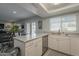 Kitchen with island, stainless steel appliances, and backyard access at 4102 E Blanche Dr, Phoenix, AZ 85032