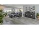 Living room with gray sectional sofa, and wood-look floors at 4102 E Blanche Dr, Phoenix, AZ 85032