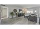 Living Room with gray sectional sofa and large TV at 4102 E Blanche Dr, Phoenix, AZ 85032