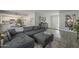 Open living area with sectional sofa, kitchen view, and calming atmosphere at 4102 E Blanche Dr, Phoenix, AZ 85032
