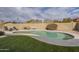 Enjoy this kidney shaped pool with lush landscaping and a spacious patio area at 4102 E Blanche Dr, Phoenix, AZ 85032