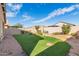 Backyard with artificial turf and desert landscaping at 4124 W Palace Station Rd, New River, AZ 85087