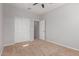 Bright bedroom with double door closet and ceiling fan at 4124 W Palace Station Rd, New River, AZ 85087