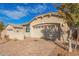 Tan house with a two-car garage and a brick driveway at 4124 W Palace Station Rd, New River, AZ 85087