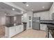 Modern kitchen with white cabinets, granite countertops, and stainless steel appliances at 4124 W Palace Station Rd, New River, AZ 85087