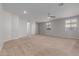 Spacious living room with neutral carpeting and a ceiling fan at 4124 W Palace Station Rd, New River, AZ 85087