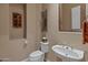 Powder room with pedestal sink and toilet at 41717 N Harbour Town Way, Anthem, AZ 85086