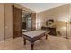 Game room with pool table and barn doors at 41717 N Harbour Town Way, Anthem, AZ 85086