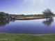 Serene golf course with lake and waterfall at 41717 N Harbour Town Way, Anthem, AZ 85086