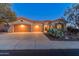 Two-story house with a two car garage and desert landscaping at 41717 N Harbour Town Way, Anthem, AZ 85086
