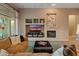 Living room with built-in entertainment center and cozy seating at 41717 N Harbour Town Way, Anthem, AZ 85086