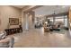 Open living room with views into kitchen and backyard at 41717 N Harbour Town Way, Anthem, AZ 85086