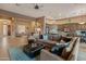 Bright living room featuring comfortable seating and views into adjacent areas at 41717 N Harbour Town Way, Anthem, AZ 85086