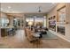 Open living area showcasing a fireplace, large windows, and ample natural light at 41717 N Harbour Town Way, Anthem, AZ 85086