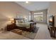 Main bedroom with large window and en-suite bathroom at 41717 N Harbour Town Way, Anthem, AZ 85086