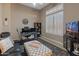 Home office with built-in desk, comfortable seating, and large window at 41717 N Harbour Town Way, Anthem, AZ 85086