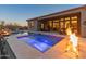 Entertain in style at this backyard pool and spa with fire pit at 41717 N Harbour Town Way, Anthem, AZ 85086