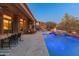 Expansive pool and spa with a water feature and outdoor seating at 41717 N Harbour Town Way, Anthem, AZ 85086