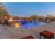 Resort-style backyard with a large pool and spa at 41717 N Harbour Town Way, Anthem, AZ 85086