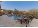 Relax by the inviting pool and take in mountain views at 41717 N Harbour Town Way, Anthem, AZ 85086