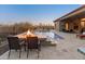 Spacious backyard with a stunning pool and fire pit at 41717 N Harbour Town Way, Anthem, AZ 85086