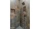 Walk-in shower with mosaic tile detail at 41717 N Harbour Town Way, Anthem, AZ 85086