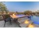 Relax in the luxurious spa with waterfall feature at 41717 N Harbour Town Way, Anthem, AZ 85086