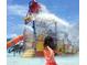 Fun water park with slides and sprinklers at 41717 N Harbour Town Way, Anthem, AZ 85086