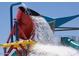 Community waterpark with slides and a large dumping bucket at 41717 N Harbour Town Way, Anthem, AZ 85086