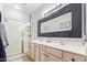 Elegant bathroom with double vanity and walk-in shower at 44783 W Alamendras St, Maricopa, AZ 85139