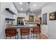 Modern kitchen with island and stainless steel appliances at 44783 W Alamendras St, Maricopa, AZ 85139