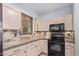 Bright kitchen features updated countertops and cabinetry at 44783 W Alamendras St, Maricopa, AZ 85139