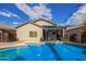 Beautiful pool area with pergola and landscaping at 44783 W Alamendras St, Maricopa, AZ 85139