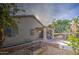 Backyard with a covered patio, grill, and a lemon tree at 4714 E Paso Trl, Phoenix, AZ 85050