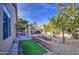 Backyard with a covered patio, grill, and artificial turf at 4714 E Paso Trl, Phoenix, AZ 85050