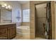 Bathroom boasts a large soaking tub and walk-in shower at 4714 E Paso Trl, Phoenix, AZ 85050