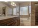 Double vanity bathroom with granite countertop and large mirror at 4714 E Paso Trl, Phoenix, AZ 85050