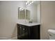 Modern bathroom vanity with double sinks and mirror at 4714 E Paso Trl, Phoenix, AZ 85050