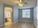 Bright bedroom with ensuite bathroom and wood-look floors at 4714 E Paso Trl, Phoenix, AZ 85050