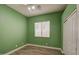 Bright bedroom with wood-look floors and window blinds at 4714 E Paso Trl, Phoenix, AZ 85050
