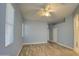 Light blue walls and wood-look floors in this comfortable bedroom at 4714 E Paso Trl, Phoenix, AZ 85050